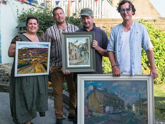 Success - the winning pictures in Create Longridge 2018.
Wayne Hayhurst (Raymond James Investment Services) and Peace Townsend (Hoppy Days)  with first prize winner Adam Ralston (third from left) and Andrew Farmer (right) who came second.  Peace  is holding the painting by John McCloskey who won third place.