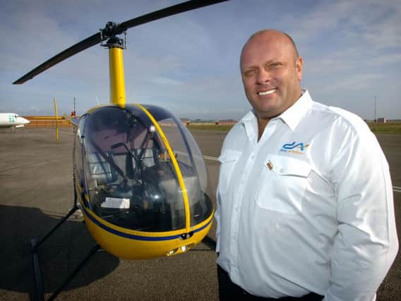 Disley pictured in 2009 after buying Blackpool Helicentre at the airport