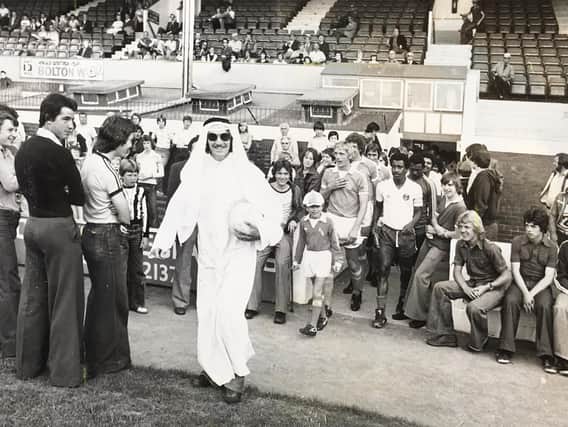 Steve Harrison leads the teams out dressed as an Arab sheikh