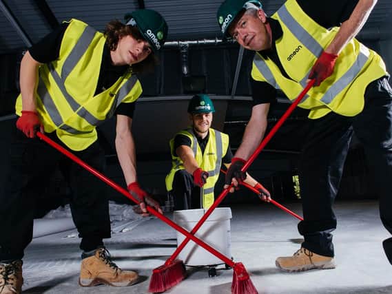 Brushing up on some construction site Curling skills are Ameon's George Guy, Anton Willis and Lyndon Brook at the Flower Bowl at Barton Grange where the team has installed hi-tech heat recovery and moisture extraction equipment