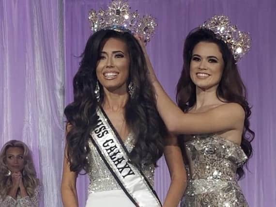 Joanna Johnson, left, crowned Miss Galaxy at the world competition in Orlando