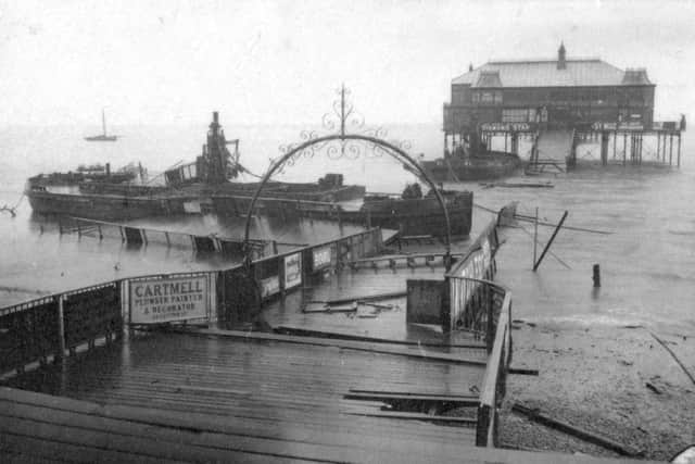 Lytham Pier in 1903 after the great storm, when steel barges broke their moorings and sliced the pier in half. It was repaired, but was later demolished in 1960