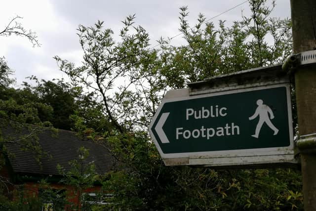 Councillor claims footpath signs can take three years to replace.