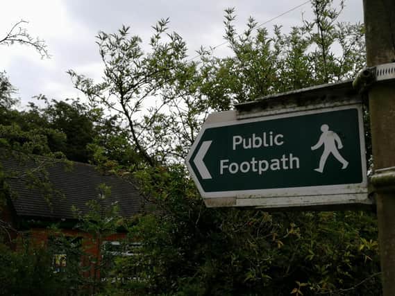 Councillor claims footpath signs can take three years to replace.