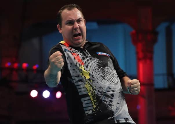 Kim Huybrechts finally celebrated victory on the Winter Gardens stage	      Picture: Lawrence Lustig/PDC