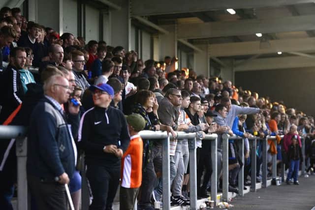 Blackpool fans watch on from the away end. Photo: Steve McLellan