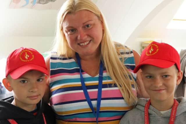 St Kentigern's Primary School deputy head Julie Jones with the boys who will be staying with her family in the holidays
