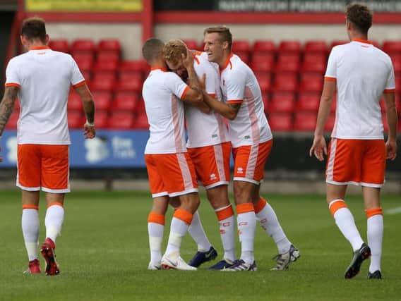 Chris Taylor is congratulated after giving Blackpool the lead