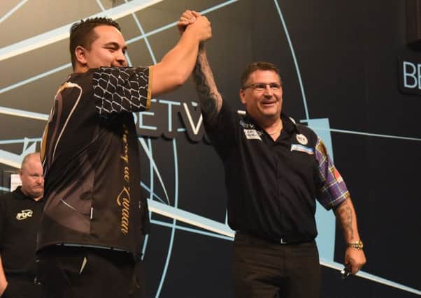 Gary Anderson (right) celebrates defeating Jeffrey de Zwaan in a high quality semi-final