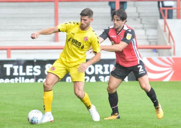Picture by Julian Brown 28/07/18 

Fleetwood's Ched Evans and Morecambe's Zak Mills

Morecambe (Red)
v 
Fleetwood (Yellow)

Pre-season friendly
Names where possible
(NB. No pass had been left for me so I was sent to various entrances I eventually got in but wasted around 30 mins so got what I could...)