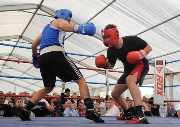 A white-collar boxing evening was organised at Kirkham and Wesham Cricket Club to raise funds for three year-old Jorgie Rae Griffiths, who is suffering from neuroblastoma. Action from the bout featuring Andy Davis (left) against Zach Sidani .  PIC BY ROB LOCK 28-7-2018
