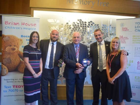 Head of fundraising Linzi Warburton, Card Saver Business Development Director Ross Chapman, Trinity Hospice trustee Tom Inman, Andy Pilley and Trinity Hospice & Brian House Corporate & Community Team Leader Michelle Lonican.