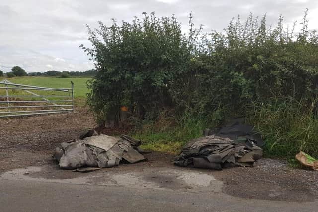 Roofing felt has also been dumped on the country lane.