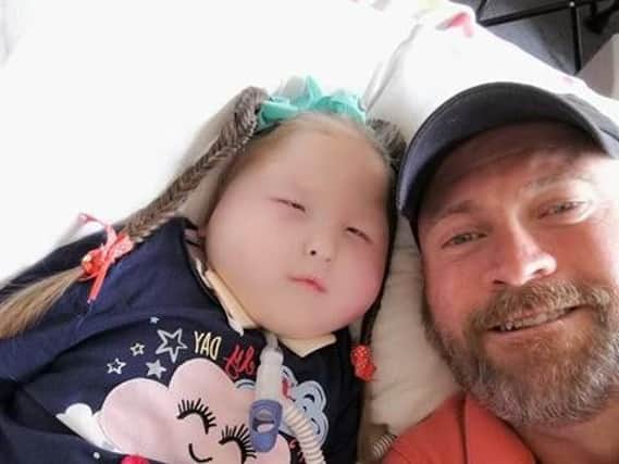 Aerospace worker Paul Fisher, 49, from Leyland with his four-year-old granddaughter Millie, who has a rare genetic condition