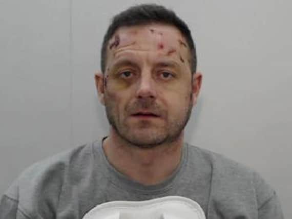 Michael Marler, 37, who has has been jailed for a minimum of 21 years at Manchester Crown Court after he stabbed his 24 year old girlfriend Danielle Richardson to death before jumping out of a window and attacking passers-by.  Photo credit: GMP/PA Wire