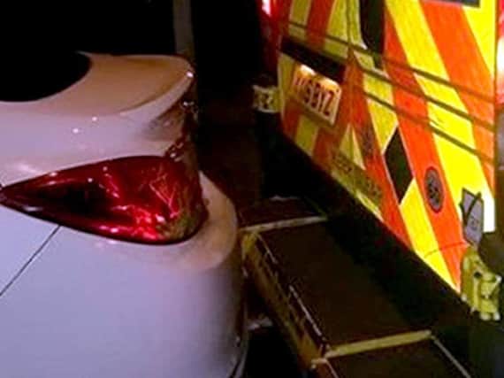 The car blocking in the ambulance's back doors (Photo: East Midlands Ambulance Service/PA Wire)