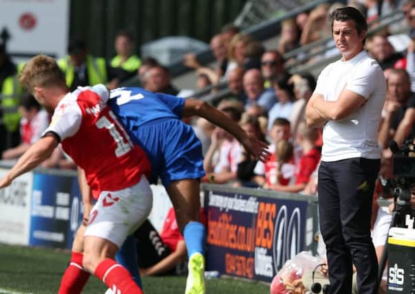 Fleetwood Town manager Joey Barton watches on