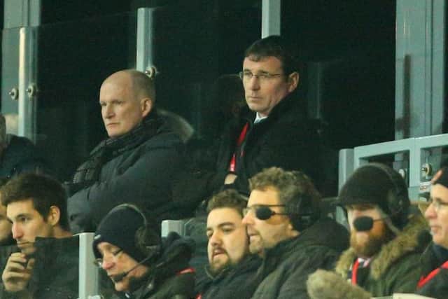 Grayson pictured with Gary Bowyer at Fleetwood last season