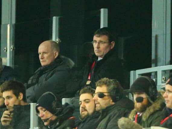 Grayson pictured with Gary Bowyer at Fleetwood last season