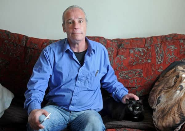 Denver Varley was the victim of a savage attack and has life-loing injuries caused by his attacker, who has now been jailed for life.  Denver is pictured at home with his cat Wispa.