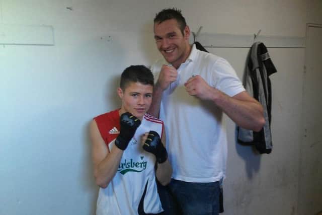 Hulme pictured as a youngster with former heavyweight world champion Tyson Fury