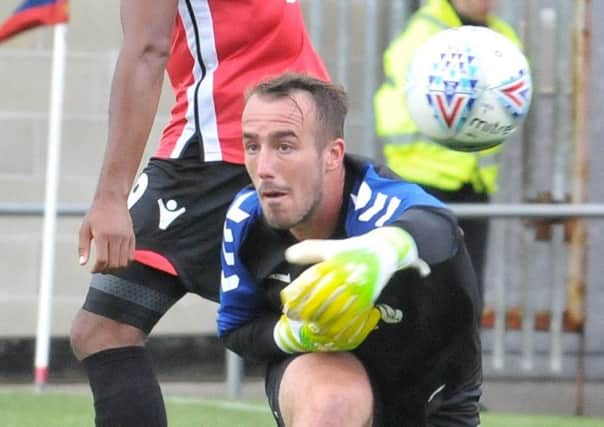 Fleetwood Town's Alex Cairns in action at Morecambe
