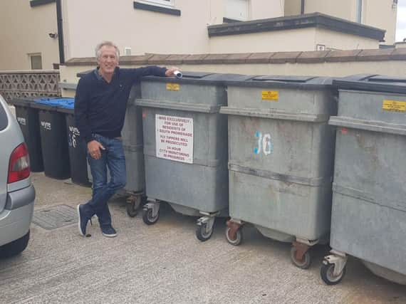 Andrew Hobson standing by the bins. This is where the offending bin was blown from.