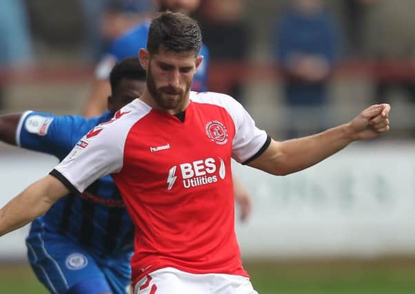 Fleetwood Town striker Ched Evans is managing an injury