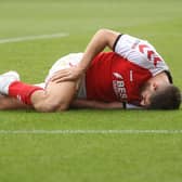 Fleetwood Town's Ched Evans goes down injured