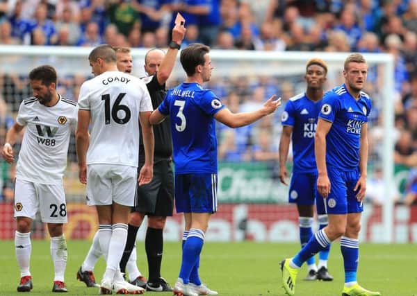 Leicester City's Jamie Vardy (right) receives a red card during the Premier League match