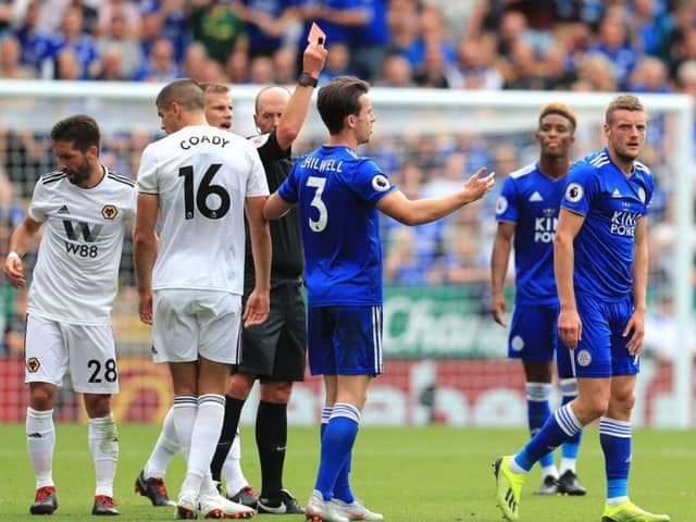 Leicester City's Jamie Vardy (right) receives a red card during the Premier League match