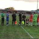 The teams line-up before kick-off