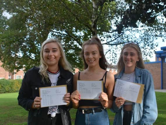Bethany Needham, Eliza Tiffen and Olivia Cooper collect their A-level results at Carr Hill, Kirkham