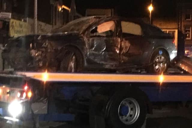 The smashed-up car is loaded onto a truck in Fleetwood