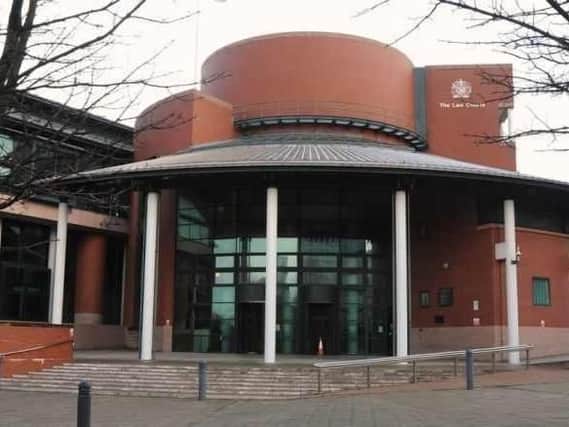 Preston Crown Court heard how a man was threatened with a knife and hit on the head with a pole before the puppy was taken.