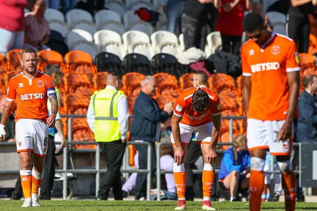 Blackpool's players with their heads bowed after Accrington's late equaliser