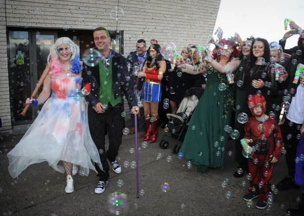 Karla O'Connor  had a Batman-themed wedding at Blackpool's Festival House.
 The bride and groom are greeted with a mass of bubbles.  PIC BY ROB LOCK