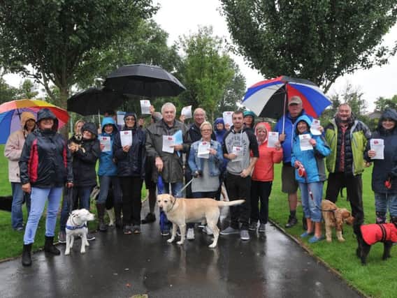 Members of the public meet in Eastpines Park, Anchorsholme to discuss new rules over dog walking