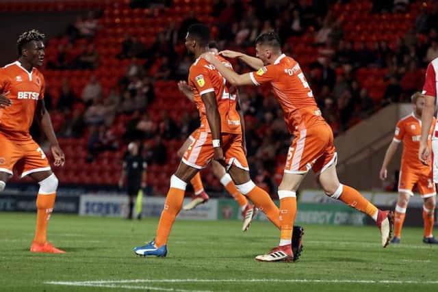 Michael Nottingham celebrates after drawing Blackpool level