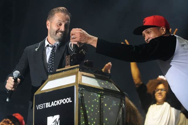 Singer 
Alfie Boe and Ashley Banjo from Diversity pull the switch