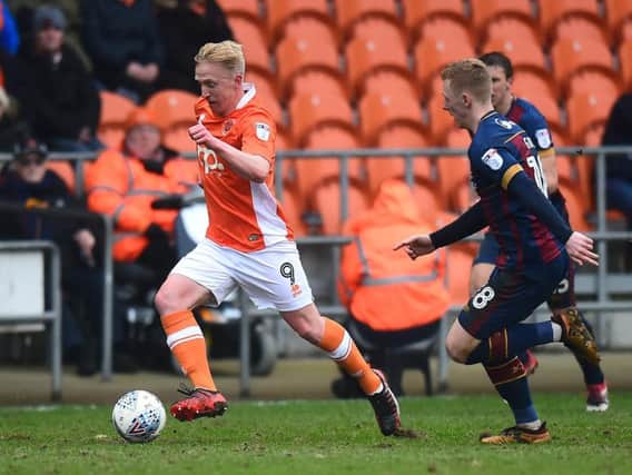 Blackpool signing Callum Guy (right) playing against his new club on loan with Bradford last season