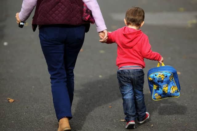 File photo dated 13/10/15 of a woman and a child (Picture: Brian Lawless/PA Wire)