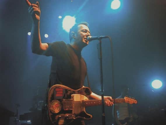Joe Strummer, former frontman with punk icons The Clash, on stage with his later band, the Mescaleros