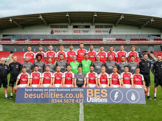 Fleetwood Town 2018-19
Back row: Nathan Sheron, James Husband, Gethin Jones, Harrison Biggins, Ched Evans, Cian Bolger, Tommy Spurr, Wes Burns, Dean Marney, James Wallace, Eddie Clarke.
Middle row L-R: Danny Moore (kit manager), Robbie Bromley (kit manager),  Stephen Crainey professional development phase coach), Youl Mawene (head of sports science), Barry Nicholson (first team coach), David Lucas (goalkeeping coach), Alex Cairns, Paul Jones, Clint Hill (first team coach), Steve Eyre (first team coach), James Barrow (sports scientist),  Liam McGarry (head physio), Jake Barnes ( head performance analyst), Glen Cruickshank ( assistant performance analyst).
Front row: Chris Long, Jason Holt, Lewie Coyle, Paddy Madden, Ash Eastham, Joey Barton (head coach), Craig Morgan, Kyle Dempsey, Conor McAleny, Bobby Grant, Ash Hunter.