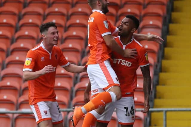 Curtis Tilt is mobbed after scoring a last-minute winner