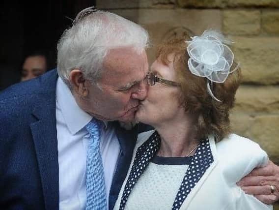 Ron and Ruth enjoy their first kiss as husband and wife outside Our Lady Star of the Sea Church  in St Annes