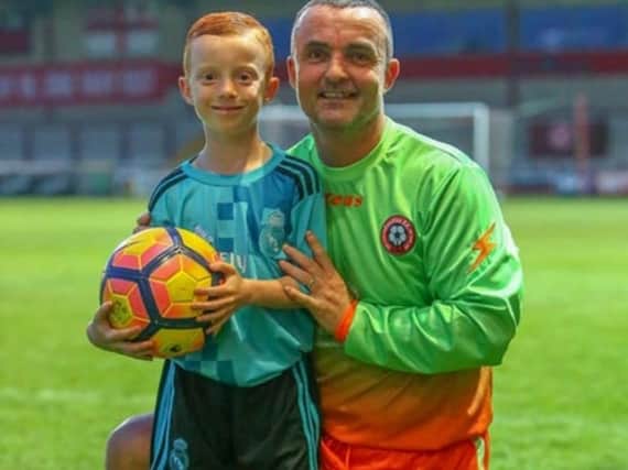 Oliver Hartley, seven, with his dad Michael