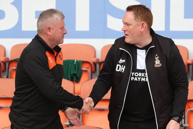 McPhillips shakes hands with new Bradford City boss David Hopkin on Saturday