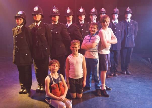 Thomas Atkinson (second from right front row) with fellow members of the cast of Billy Elliot in 2010