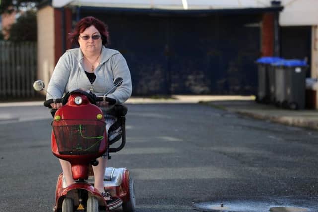 Sue Malpass with her mobility scooter